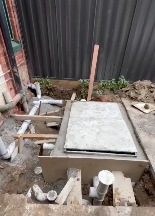 Concrete grease trap installation site
