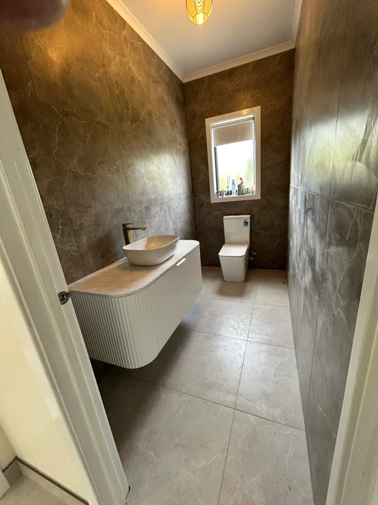 Services Modern luxury bathroom with marble wall tiles and floating vanity