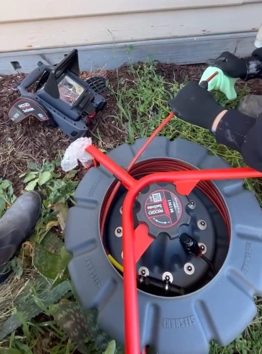 Services Plumber using CCTV for pipe inspection